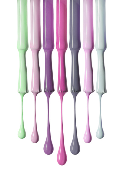 brushes with shiny pastel colors of nail polish isolated on white - Zdjęcie, obraz