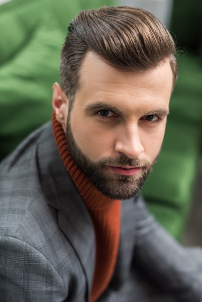 portrait of serious man in formal wear looking at camera - Фото, изображение