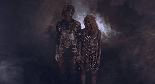 portrait of zombies together against dark misty background - Foto, Imagem