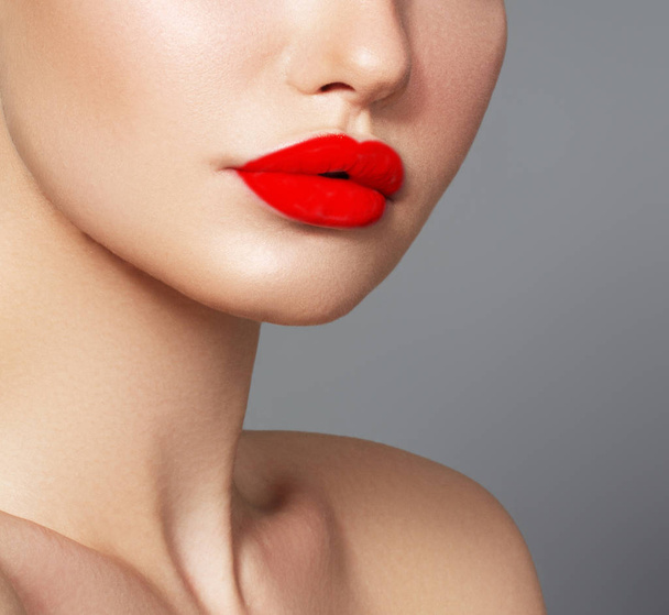 Woman health. Red Sexy Lips . Open Mouth. Makeup cosmetics. Make up concept. Beauty model girl's face isolated on white background. Filler injections. Lip augmentation, Beautiful Perfect Lips - Fotó, kép