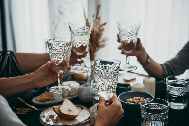 Glasses of white wine seen during a friendly party of a celebration. - Φωτογραφία, εικόνα