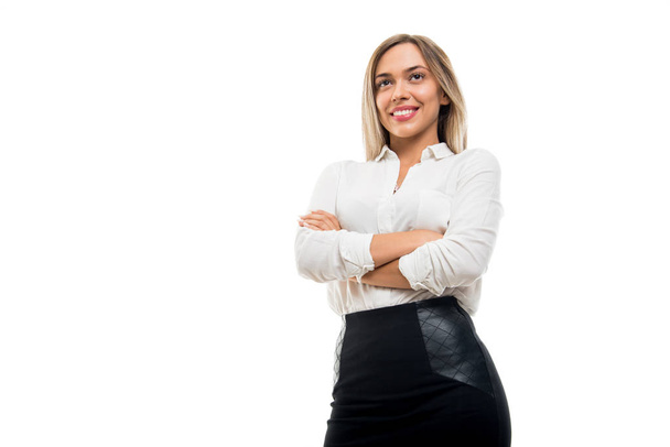 Low angle of beautiful business woman standing with arms crossed isolated on white background with copy space advertising area - Φωτογραφία, εικόνα