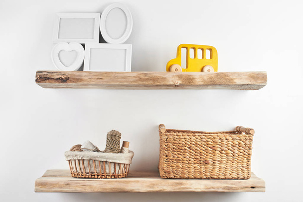 Wooden shelves with decor items. Home interior - Zdjęcie, obraz