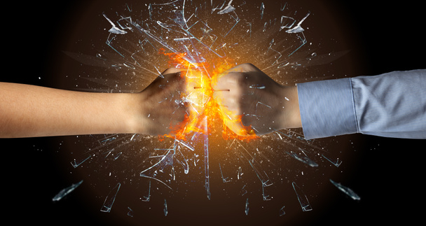 Fighting hands breaking glass - Photo, Image