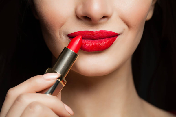 Red color lips, macro. Makeup and cosmetics concept - 写真・画像