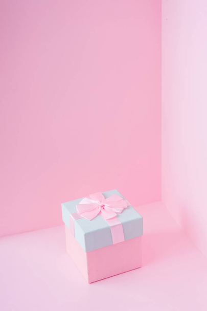 pink and blue Christmas gift box on pastel backdrop. New Year present concept  - Φωτογραφία, εικόνα
