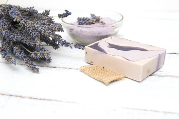 Natural lavender soap with lavender flowers on it - Photo, image