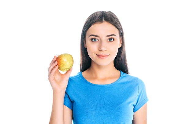 portrait of attractive young woman holding fresh apple isolated on white - Foto, Imagen