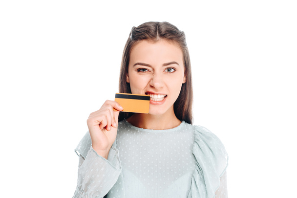 portrait of woman biting credit card isolated on white - Photo, Image