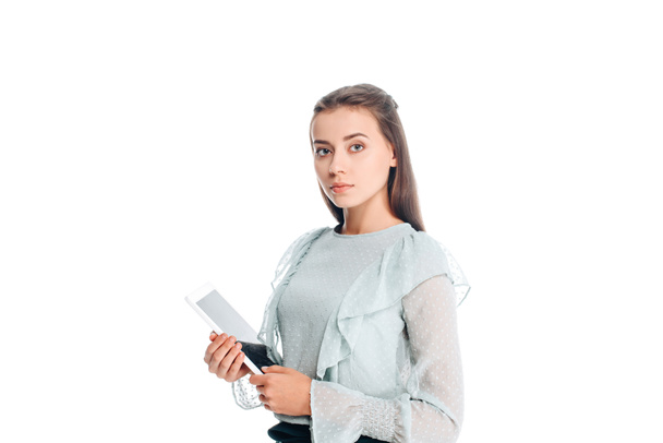 portrait of young woman with tablet looking at camera isolated on white - Foto, afbeelding