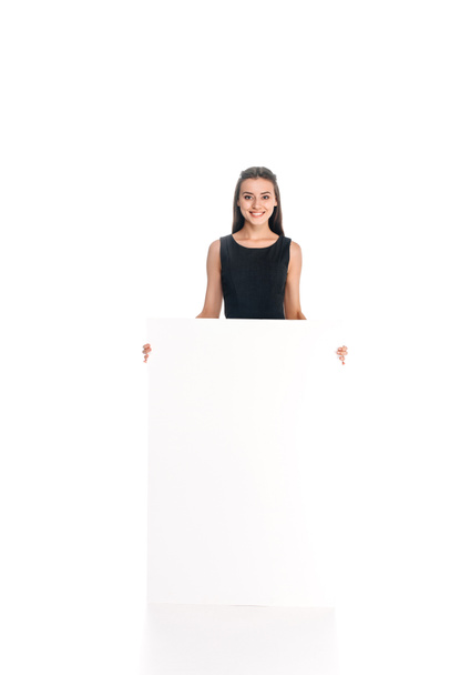 smiling young woman with blank banner isolated on white - Foto, immagini