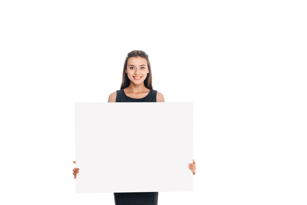 portrait of smiling young woman with blank banner isolated on white - Fotó, kép