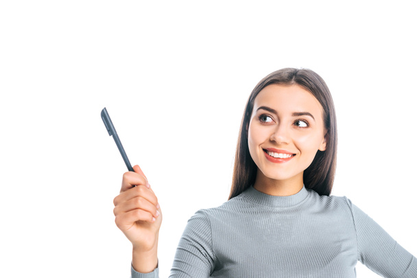 portrait of smiling woman with pen pointing away isolated on white - Φωτογραφία, εικόνα