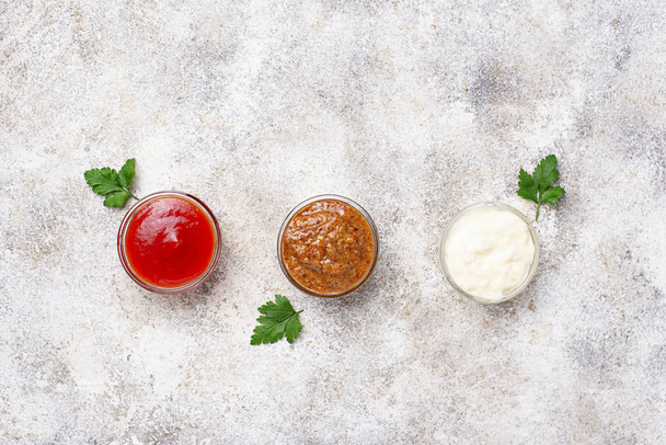 Set of different sauces: mustard, ketchup, mayonnaise - Foto, imagen