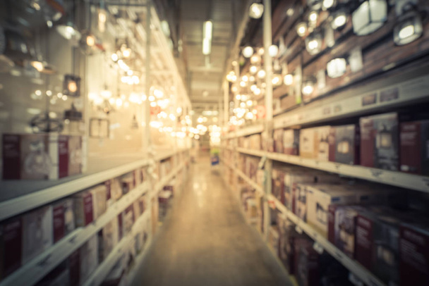Vintage tone blurred abstract wide selection of ceiling fans with lights on display at hardware store in USA. Defocused background coastal, classic, modern, cottage, rustic, industrial, LED fans - Foto, imagen