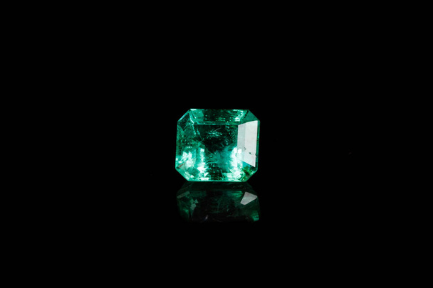 Macro mineral Emerald gemstone faceted on black background close up - Photo, Image