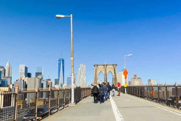 New York, USA - June 20, 2015: The Brooklyn Bridge. Walk on the bridge. Walking through the streets of New York, Manhattan. The life of New York in the afternoon. Streets and city buildings. - Valokuva, kuva