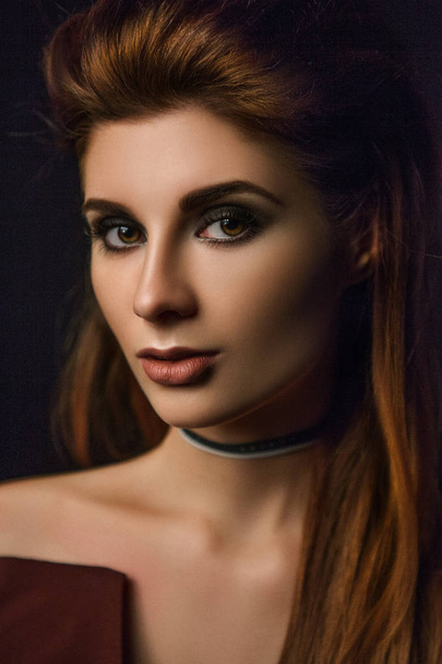 Close-up portrait of brunette woman with paper choker - Photo, image
