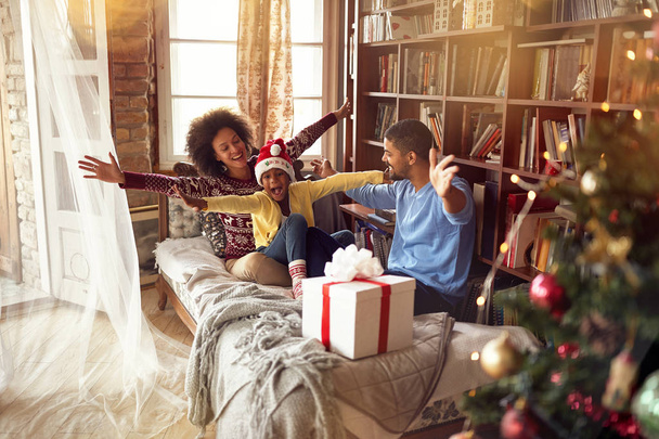 Happy African American cheerful family celebrate Christmas - Photo, image