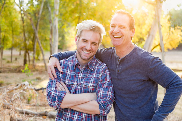 Happy Caucasian Father and Son Portrait Outdoors. - Фото, изображение