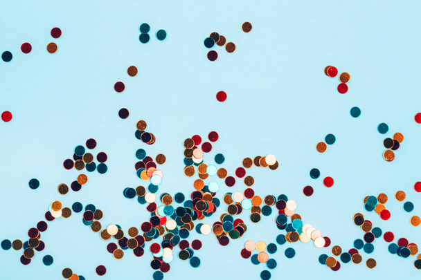 Multicolored glitter circles on blue pastel background. Perfect backdrop for your design. - Foto, immagini