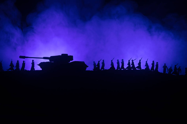 War Concept. Military silhouettes fighting scene on war fog sky background, World War German Tanks Silhouettes Below Cloudy Skyline At night. Attack scene. Armored vehicles. Tanks battle - Fotó, kép