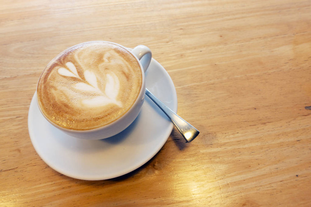 The art of hot coffee on a wooden table. - Φωτογραφία, εικόνα