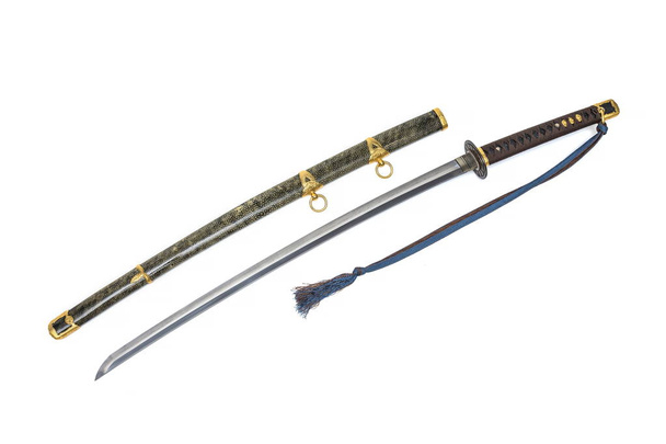 'Kai Gunto': Japanilainen merijalkaväen miekka toisesta maailmansodasta, jossa rupi kääritään valkoiseen taustaan eristetyllä rauskun iholla
. - Valokuva, kuva