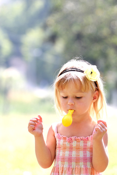 beautiful little girl in nature with balloons - Photo, image