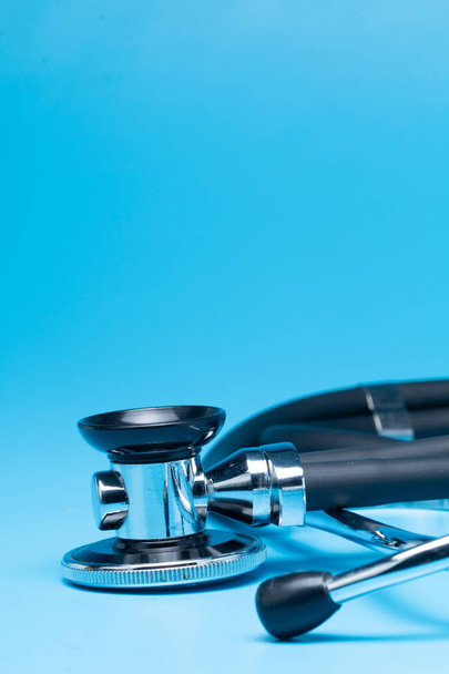 Stethoscope, close-up isolated with blue background - Photo, Image