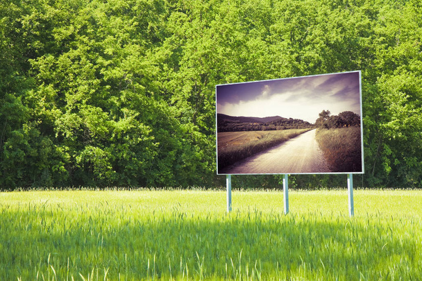 A advertising billboard shows the Tuscany landscape (Italy) - - Фото, зображення