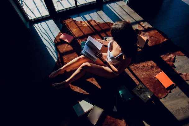 girl underwear books comfort reading against the window. - Fotoğraf, Görsel