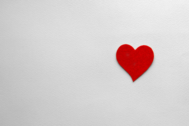 felt hearts on a paper background - Zdjęcie, obraz