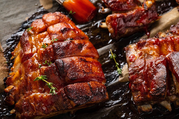 Grilled pork ribs on baking paper, top view. Copy space. - Photo, image