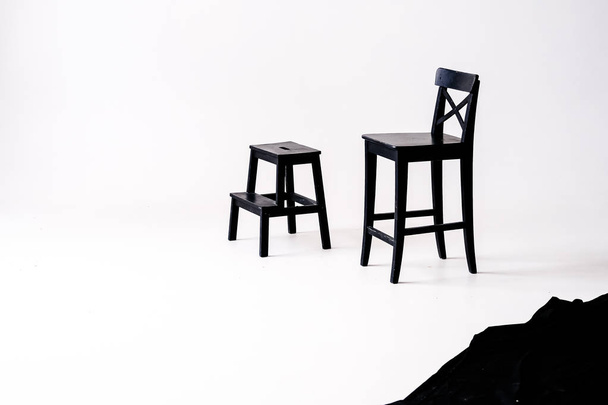 black chair on white background, in white room  - Fotoğraf, Görsel