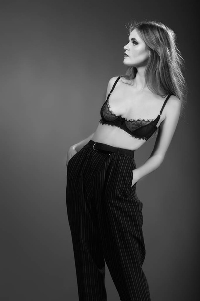 High fashion look.glamor portrait of beautiful sexy stylish Caucasian young woman model in black cloth - Foto, Imagen