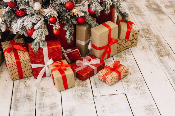 beautiful Christmas decorations and gifts under the Christmas tree - Photo, image