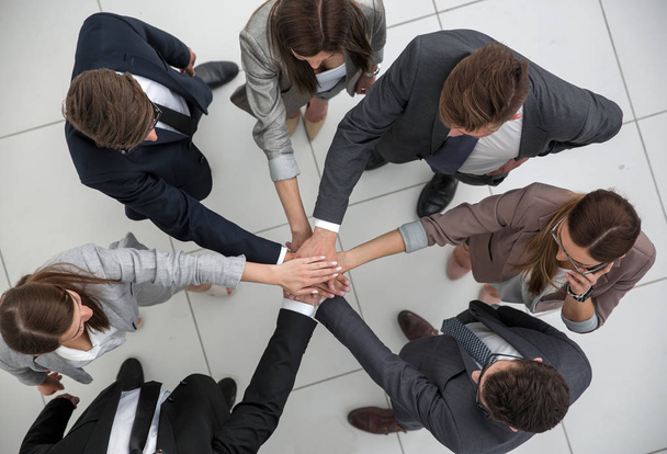 top view.the business team stands forming a circle - 写真・画像