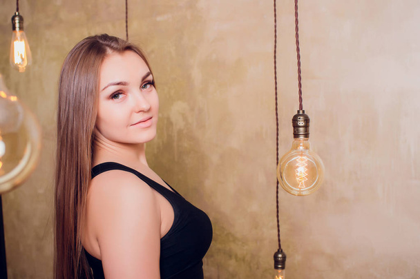 girl electric lamps and brick wall - Photo, Image