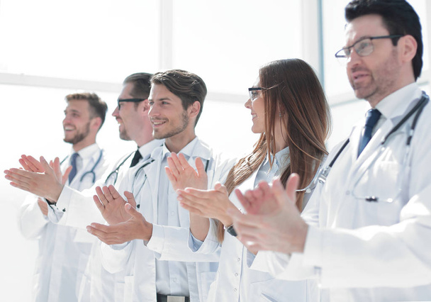 group of successful doctors applauds - 写真・画像