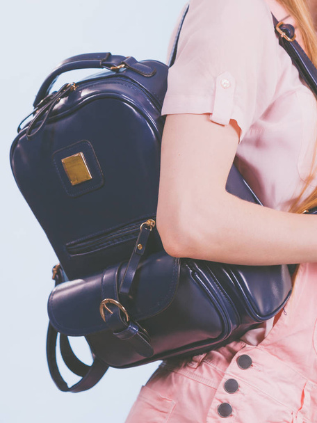 Unrecognizable teenage girl going to school or college wearing black stylish backpack. Outfit trendy accessories. - 写真・画像