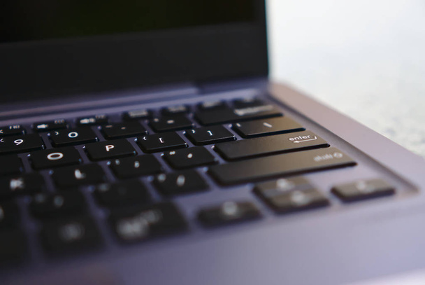 Part view of laptop keyboard with clear enter key - Zdjęcie, obraz