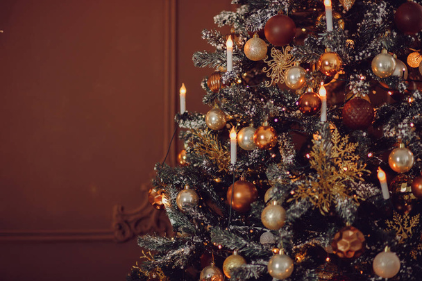 Christmas tree close-up on beautiful expensive brown wooden - Φωτογραφία, εικόνα
