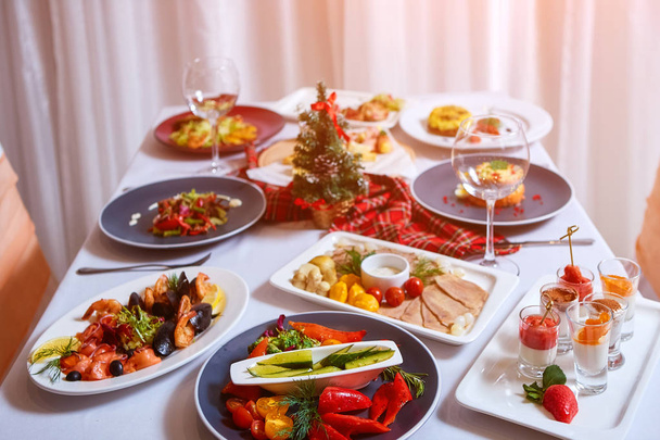 Christmas Dinner. A table in the restaurant, served for two people, is ready for the New Year - Fotó, kép