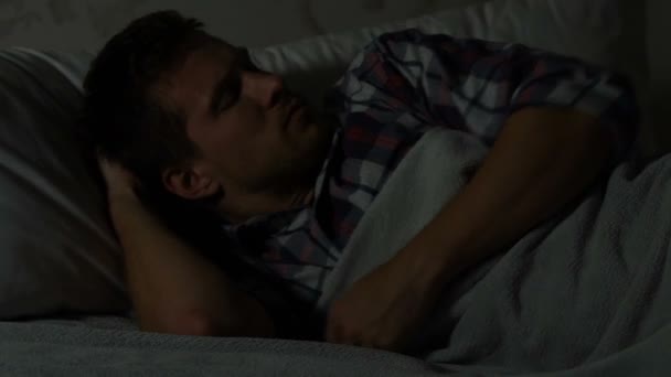 Man bad awakened by disturbing dream, suffering from nightmare, sleep conditions - Video, Çekim