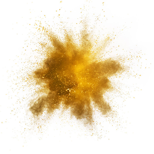 Explosion of yellow powder isolated on white background. Abstract colored background - Photo, Image