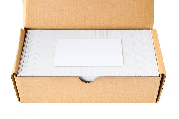 box of business cards with a blank one good for text and logo stands on top on white - Photo, Image