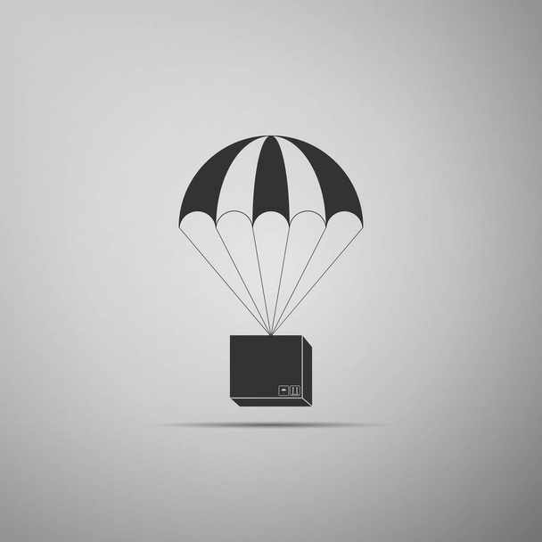 Box flying on parachute icon isolated on grey background. Parcel with parachute for shipping. Delivery service, air shipping concept, bonus concept. Flat design. Vector Illustration - Vector, Image