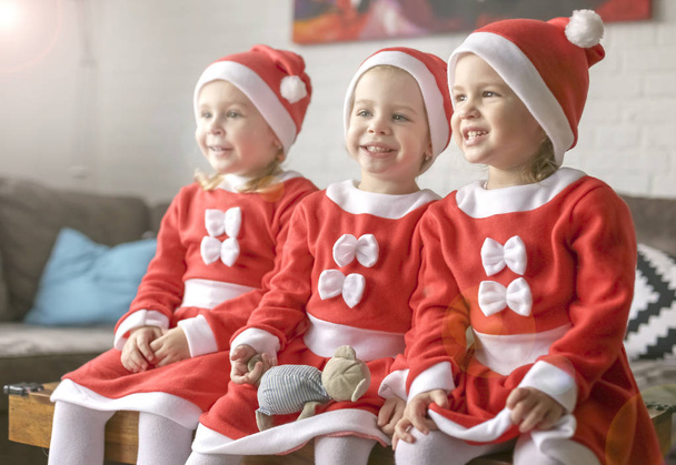 three beautiful sister girls, dressed for Santa Claus - Fotografie, Obrázek