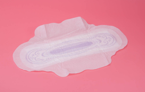 cotton medical towel or pad for women critical days on pink background. Care and protection. - Photo, Image